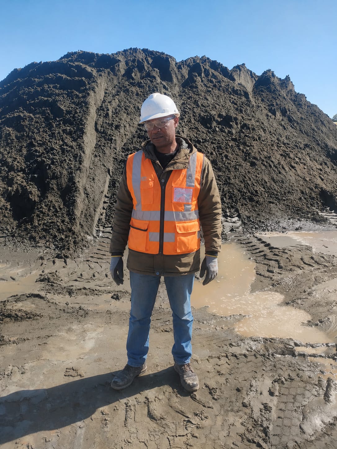 KCommercial team member inspecting a chrome stockpile